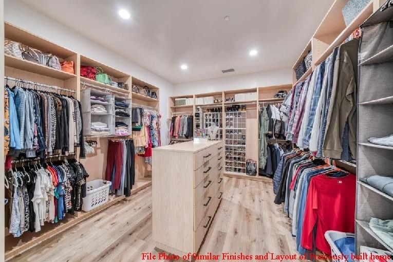 14480 Academy Oaks Lane Clovis, CA 93619 - Photo 36 of 37 a view of walk in closet with clothes and shoes