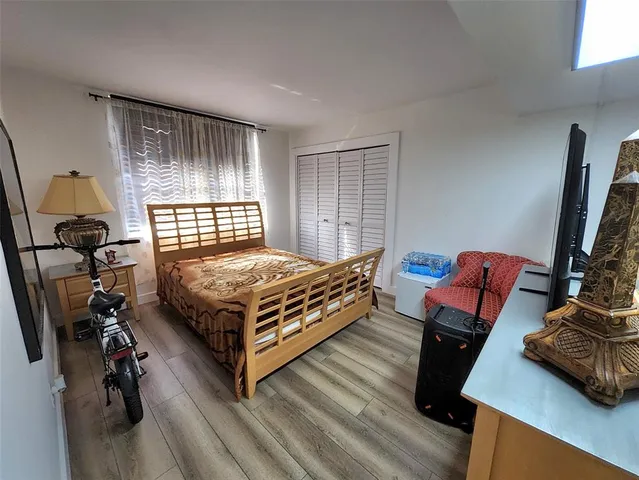 a bedroom with furniture and a window