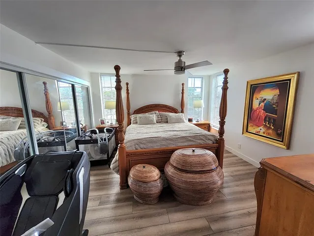 a living room with furniture flowerpot and window