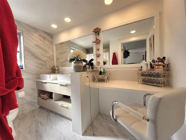 a view of living room with furniture and a chandelier