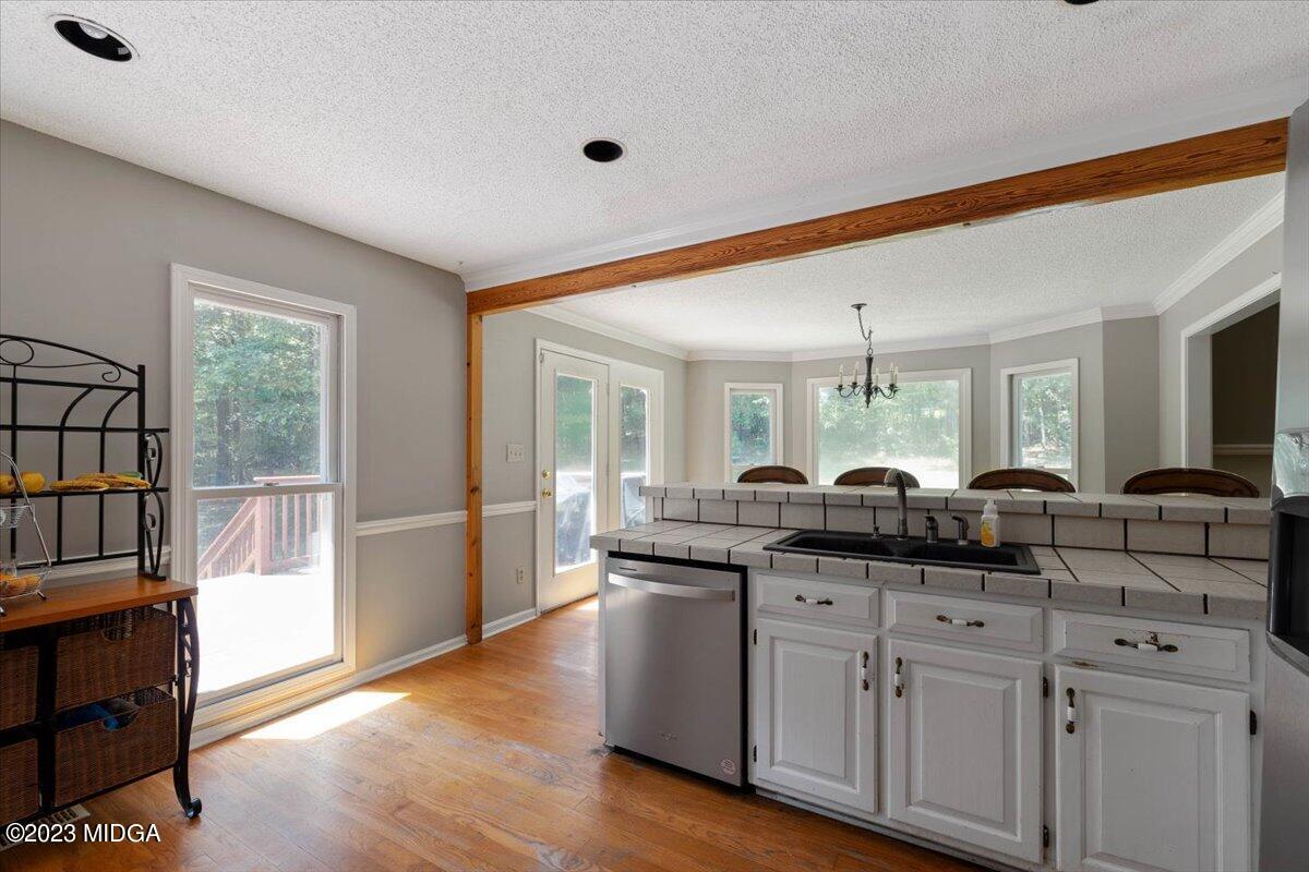 151 Deer Ridge Trail Macon, GA 31210 - Photo 11 of 43 a kitchen with granite countertop a sink and cabinets
