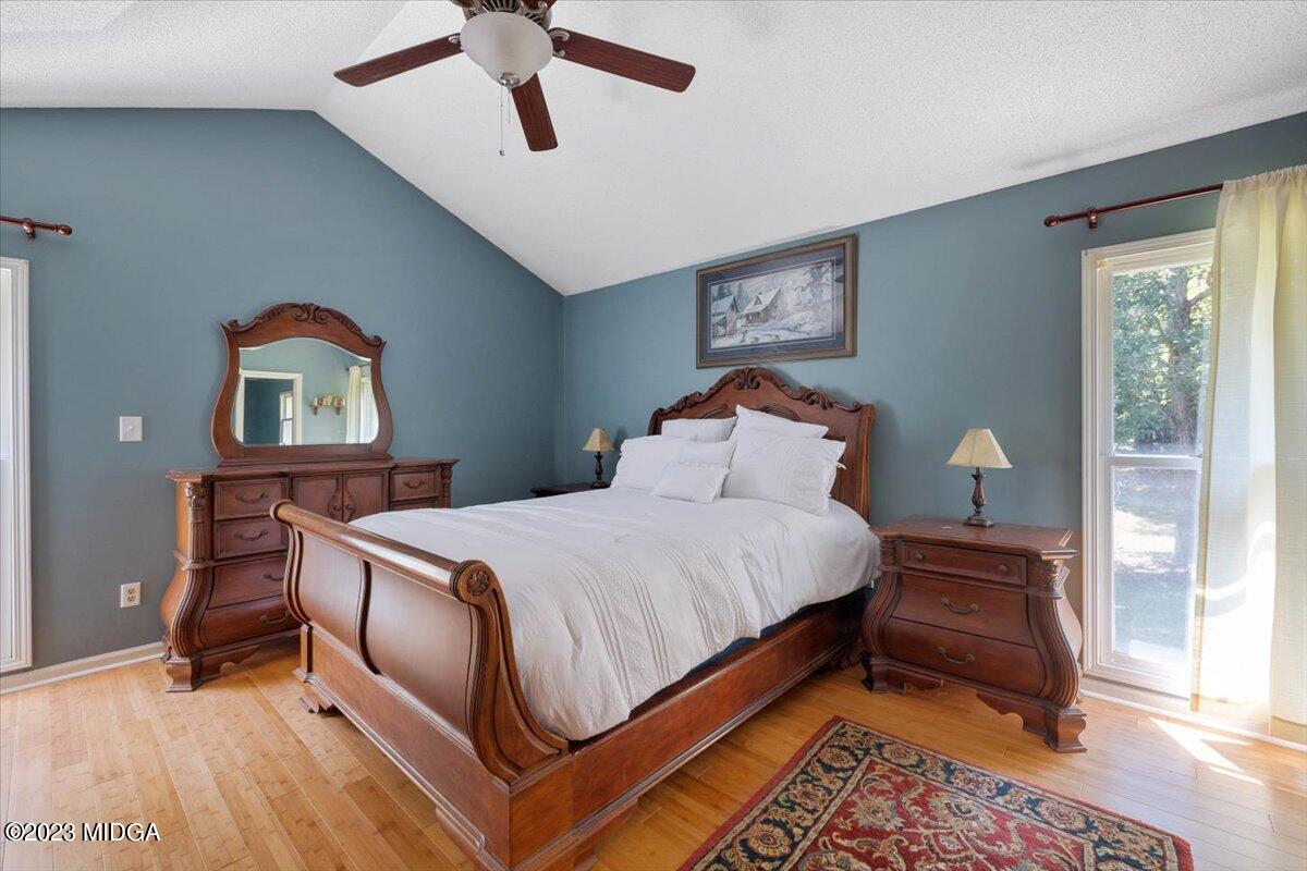 151 Deer Ridge Trail Macon, GA 31210 - Photo 13 of 43 a bedroom with a bed lamps and a mirror