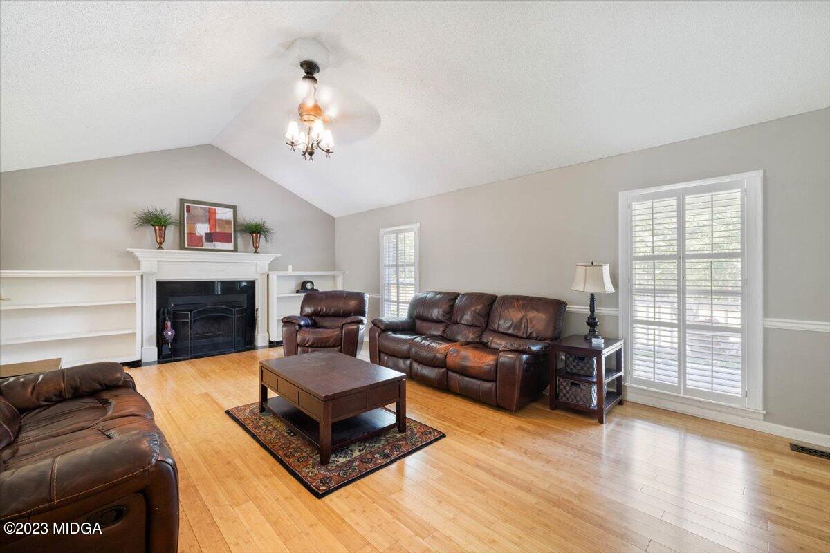 151 Deer Ridge Trail Macon, GA 31210 - Photo 4 of 43 a living room with furniture and a fireplace