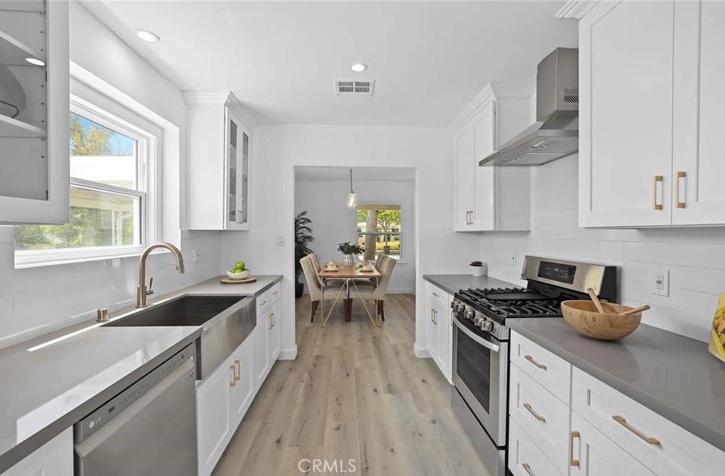 100 Eastern Pasadena, CA 91107 - Photo 10 of 18 a kitchen with sink a stove and cabinets