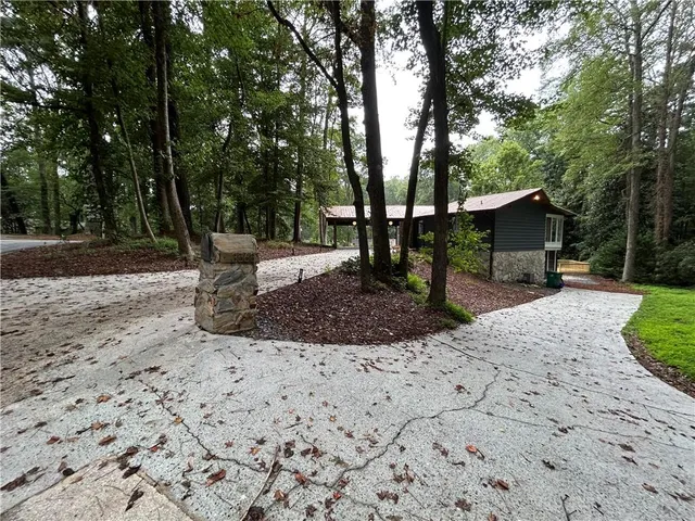 a view of a backyard with sitting area