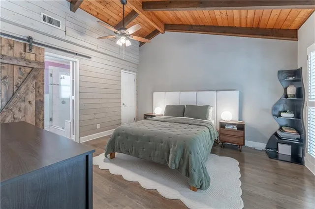 a bedroom with a bed and a view of bedroom