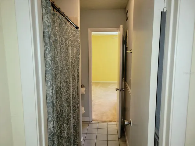 a bathroom with a shower and a sink