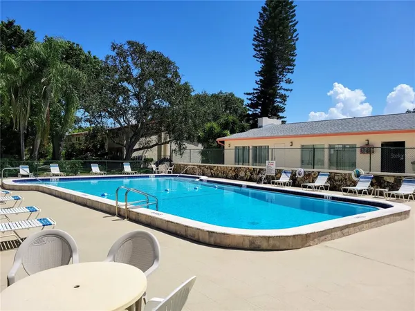 a view of a swimming pool with a patio