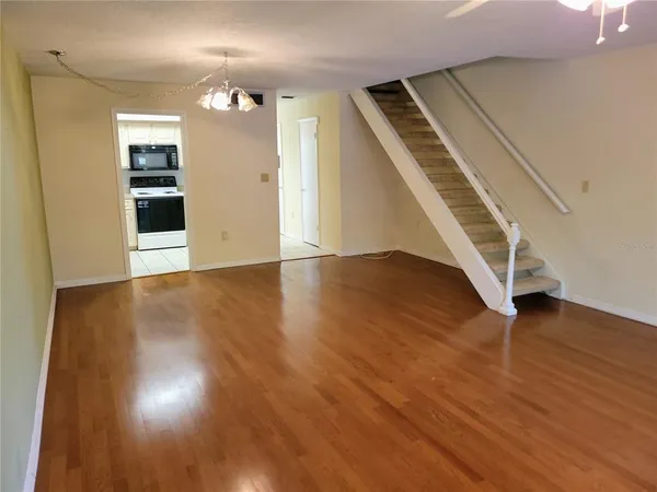 wooden floor in an empty room with a fireplace