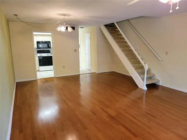 wooden floor in an empty room with a fireplace