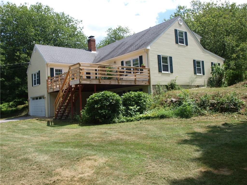 38 Reutemann Road North Stonington, CT 06359 - Photo 1 of 1 a view of a big house with a big yard and large trees