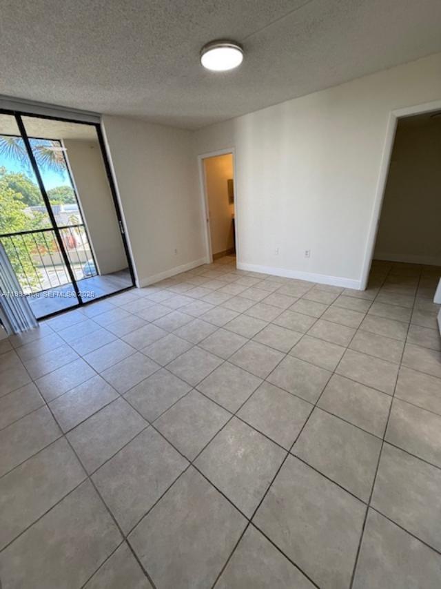 8075 Southwest 107th Avenue, Unit 305 Miami, FL 33173 - Photo 26 of 38 master bedroom with sliding door to balcony