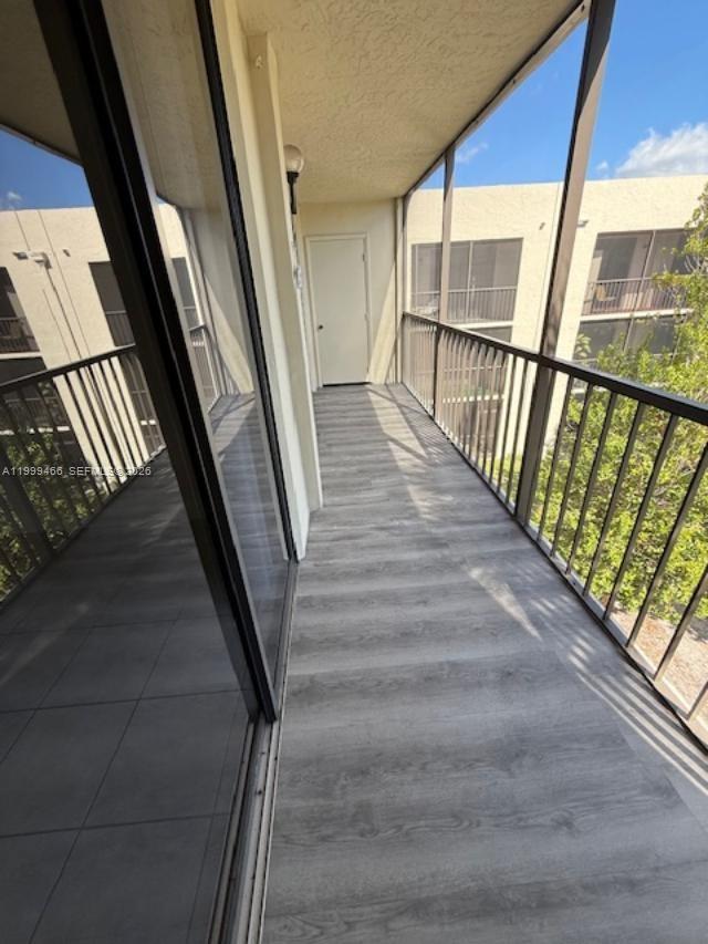 8075 Southwest 107th Avenue, Unit 305 Miami, FL 33173 - Photo 36 of 38 screened balcony with storage room