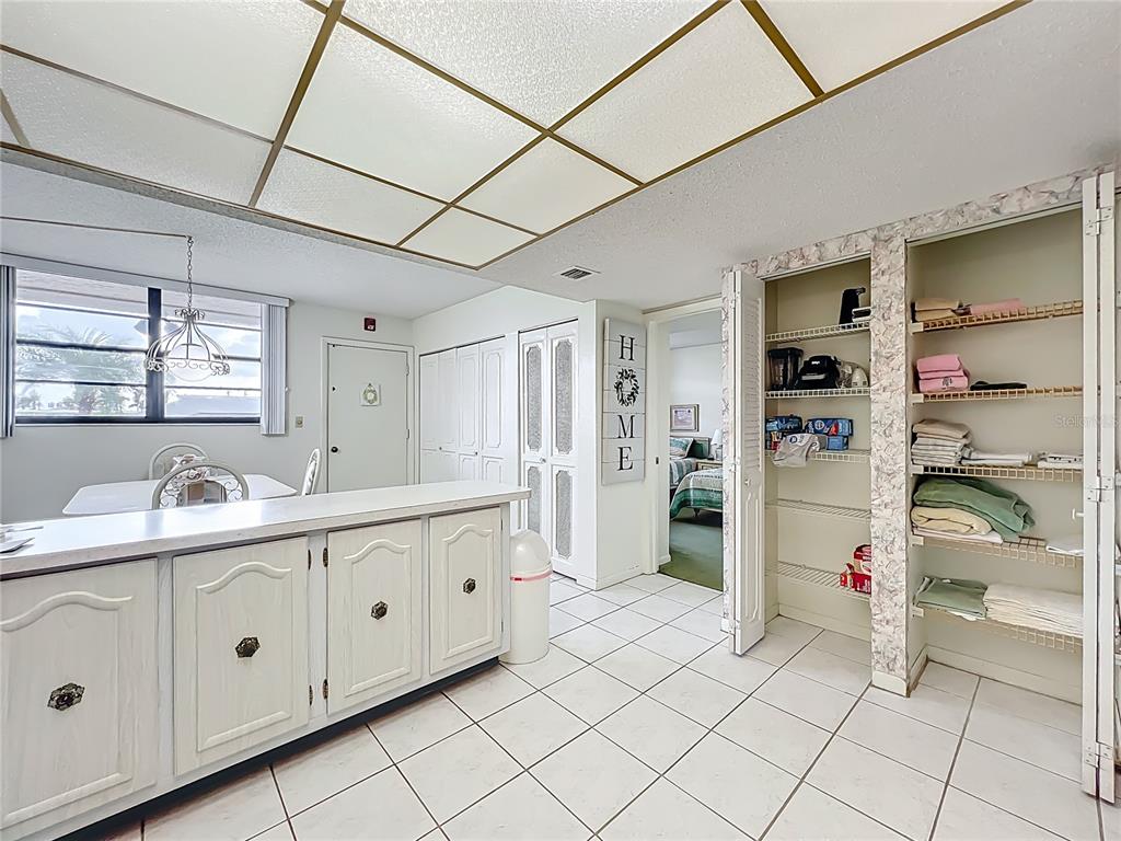 17580 Gulf Boulevard, Unit 219 Redington Shores, FL 33708 - Photo 19 of 47 a kitchen with a sink and cabinets