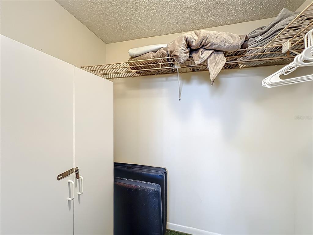 17580 Gulf Boulevard, Unit 219 Redington Shores, FL 33708 - Photo 33 of 47 a view of walk in closet with clothes
