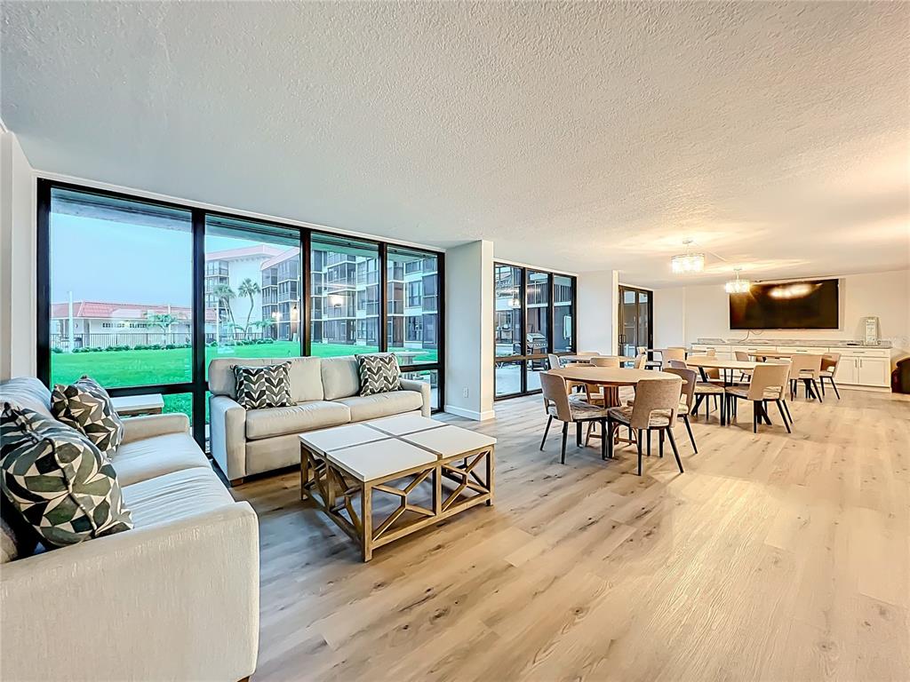 17580 Gulf Boulevard, Unit 219 Redington Shores, FL 33708 - Photo 36 of 47 a living room with furniture and a large window