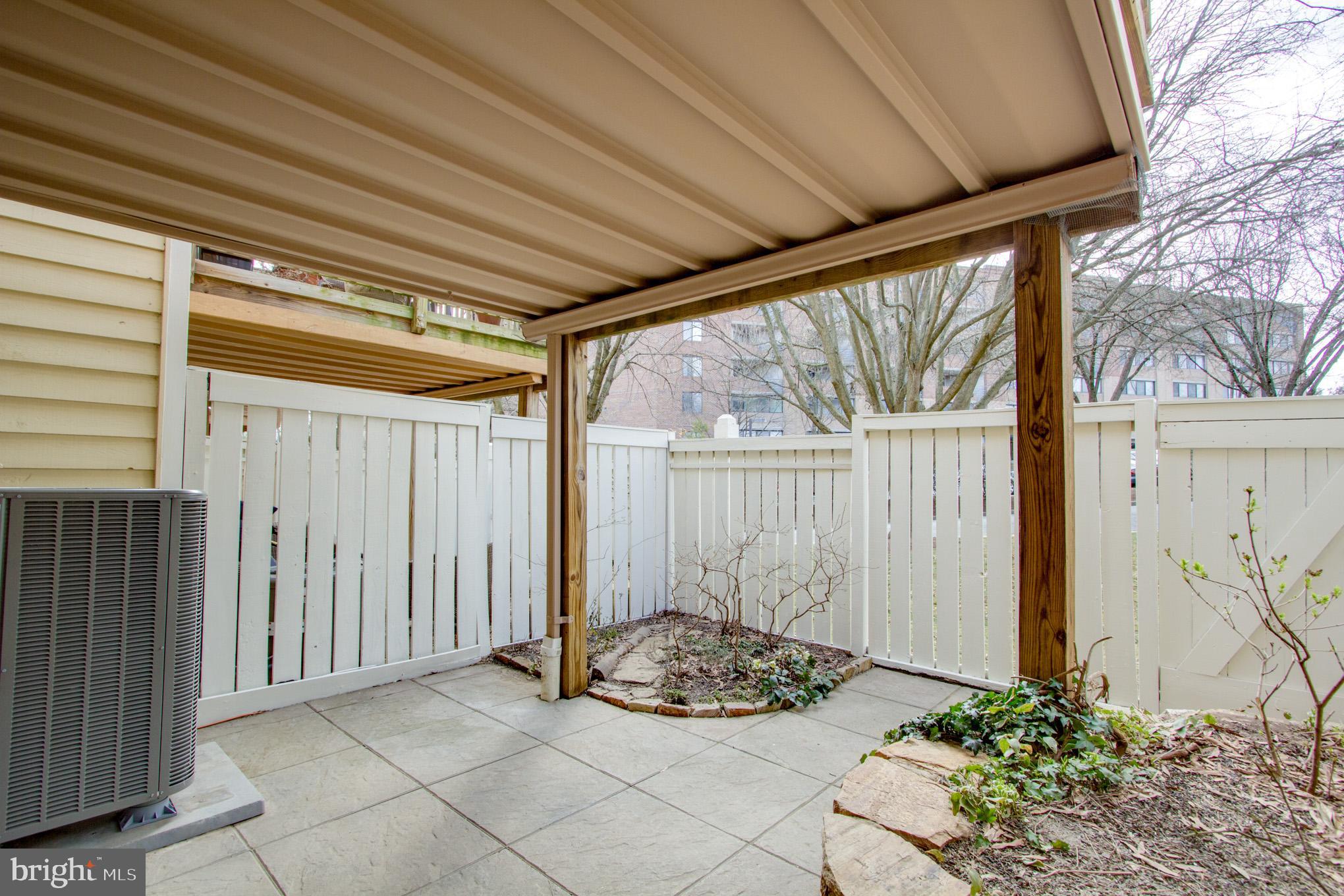 1957 Belmont Ridge Court Reston, VA 20191 - Photo 20 of 21 Covered patio is fenced with lots of plants