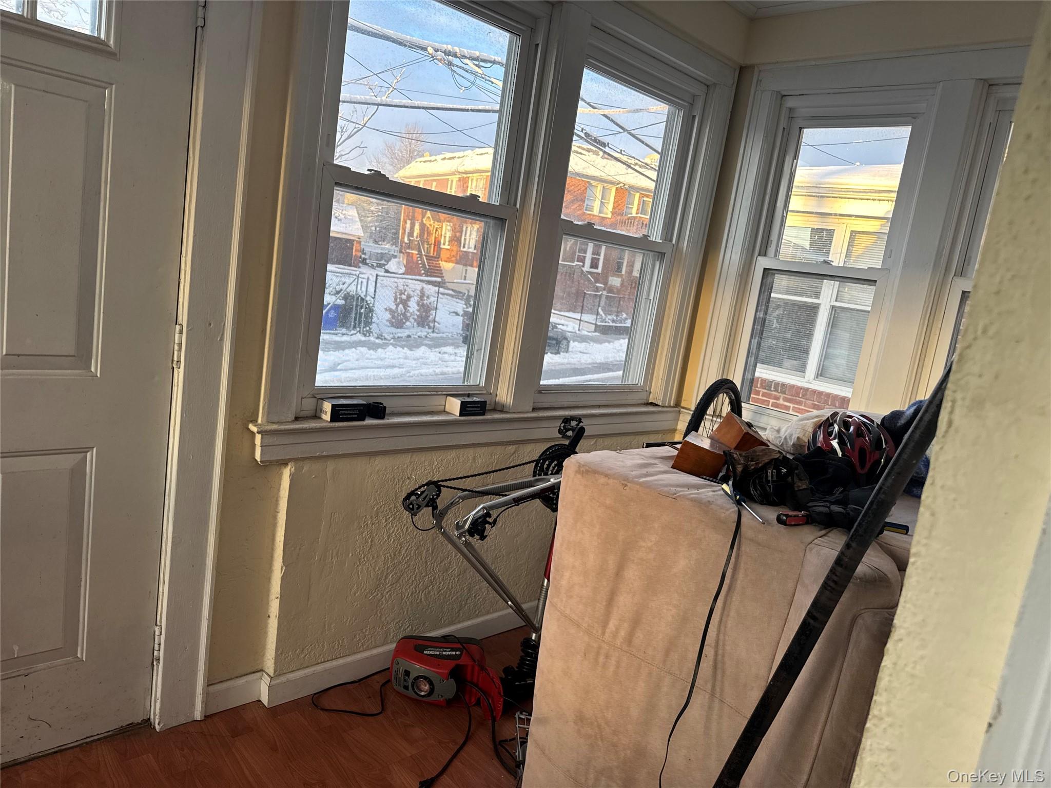 24-31 Deerfield Road Queens, NY 11691 - Photo 13 of 25 Detailed view of wood finished floors and a textured wall