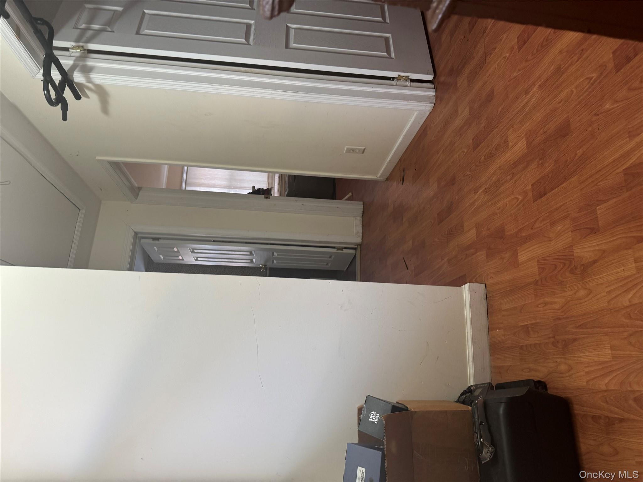 24-31 Deerfield Road Queens, NY 11691 - Photo 16 of 25 Hall with dark wood-type flooring and attic access