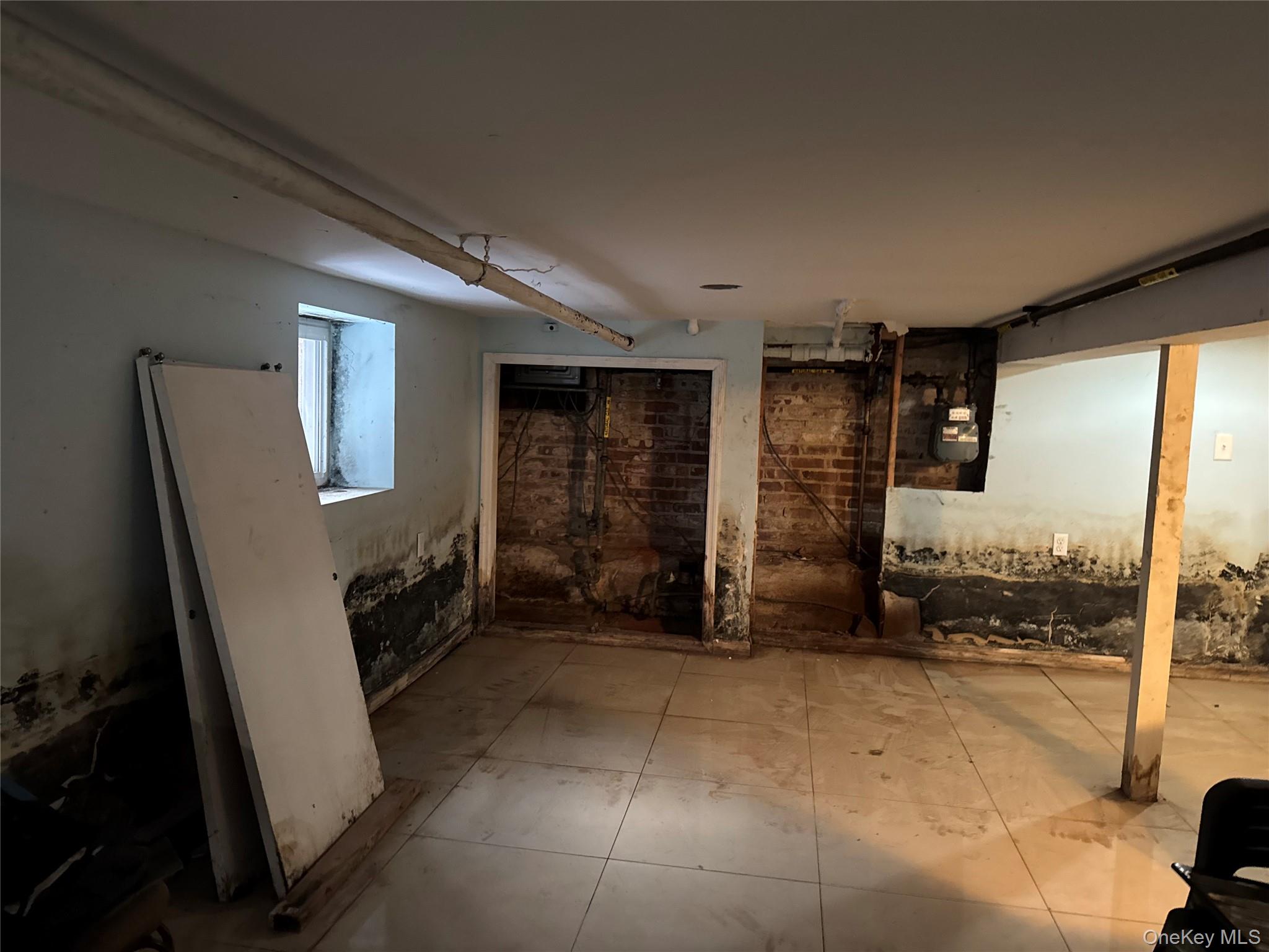 24-31 Deerfield Road Queens, NY 11691 - Photo 5 of 25 Below grade area featuring gas meter