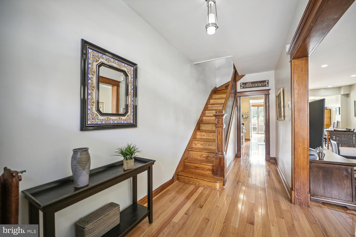 3617 13th Street Northwest Washington, DC 20010 - Photo 2 of 23 a view of a hallway with wooden floor and staircase
