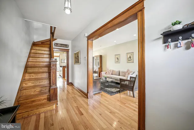 a view of living room filled with furniture and wooden floor