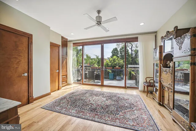 a living room with hardwood floor and a table