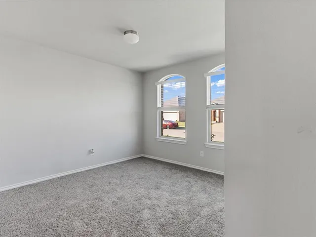 a bathroom with a granite countertop sink a bathtub and a mirror