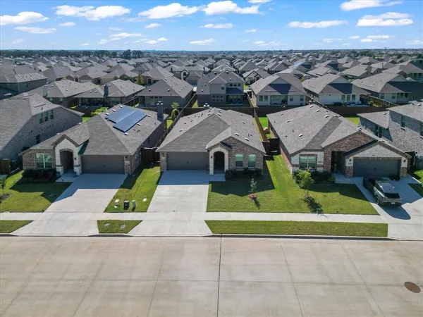 an aerial view of a house with a garden
