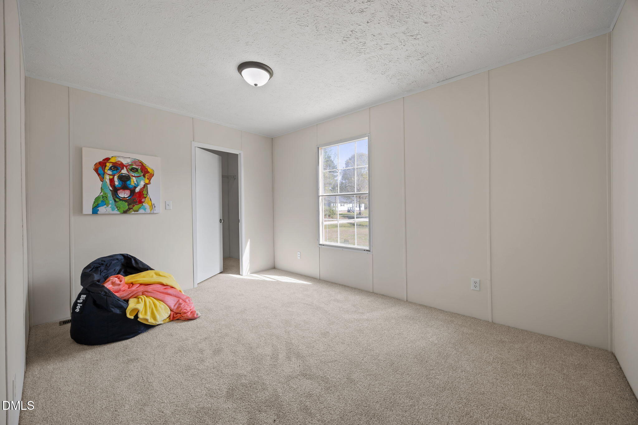 721 General Green Road Kittrell, NC 27544 - Photo 26 of 36 a bedroom with a bed and a window