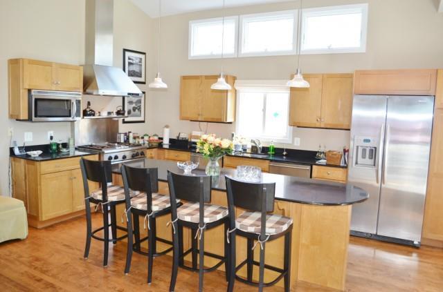 1030 Reef Road Fairfield, CT 06824 - Photo 1 of 1 a kitchen with a dining table chairs and a kitchen view
