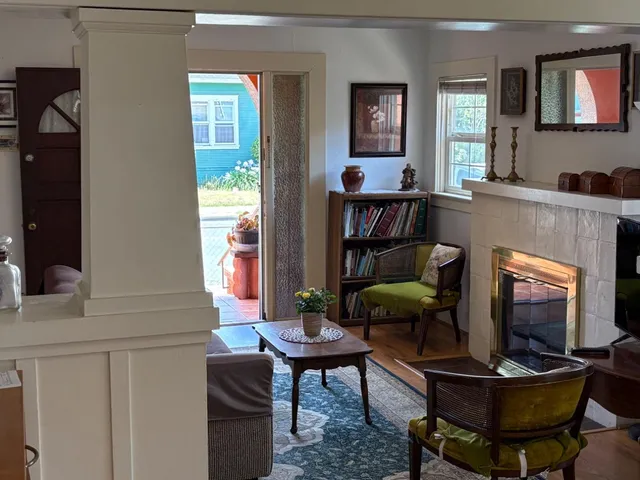 a living room with furniture and a fireplace