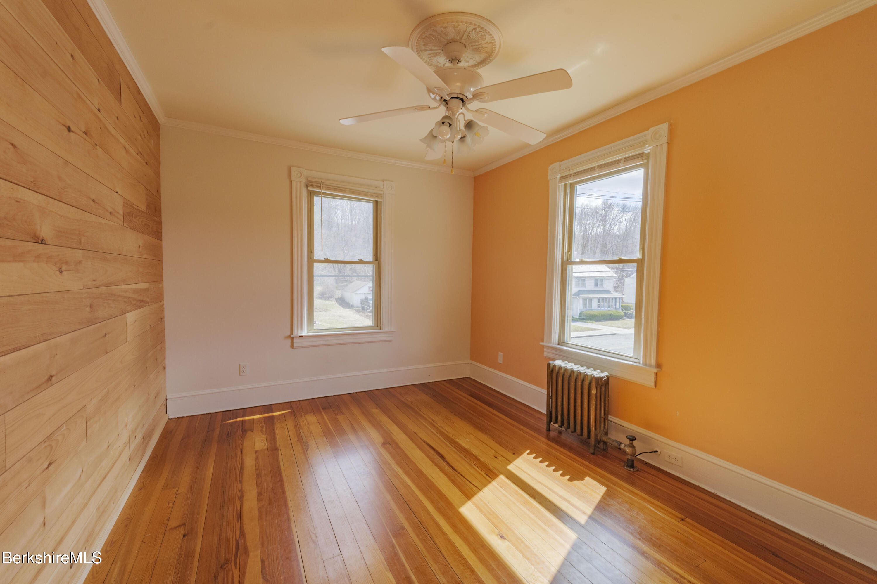 108 North Summer Street Adams, MA 01220 - Photo 13 of 28 a view of an empty room with a window and wooden floor