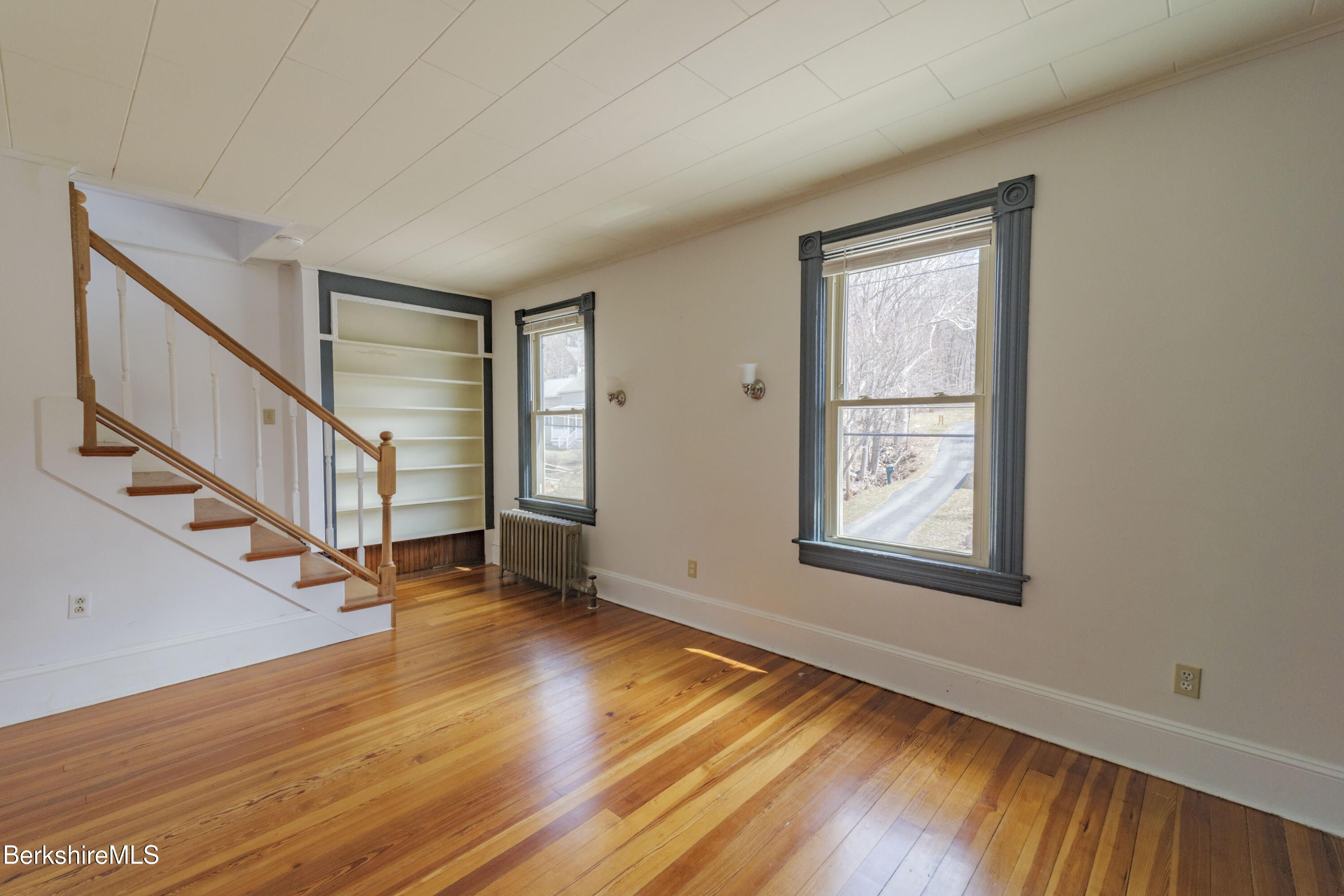 108 North Summer Street Adams, MA 01220 - Photo 15 of 28 a view of an empty room with wooden floor and a window