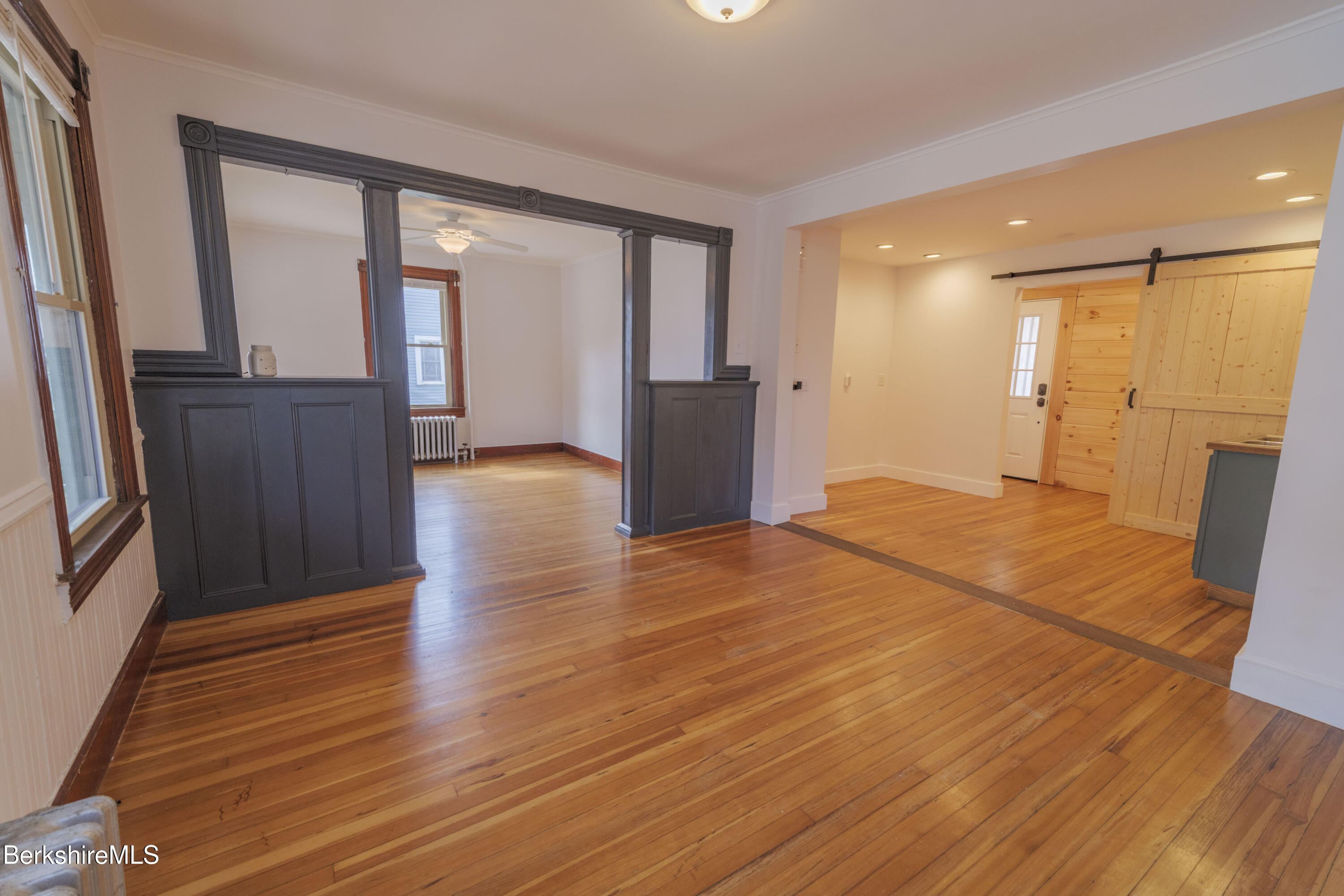 108 North Summer Street Adams, MA 01220 - Photo 2 of 28 a view of empty room with wooden floor and fan