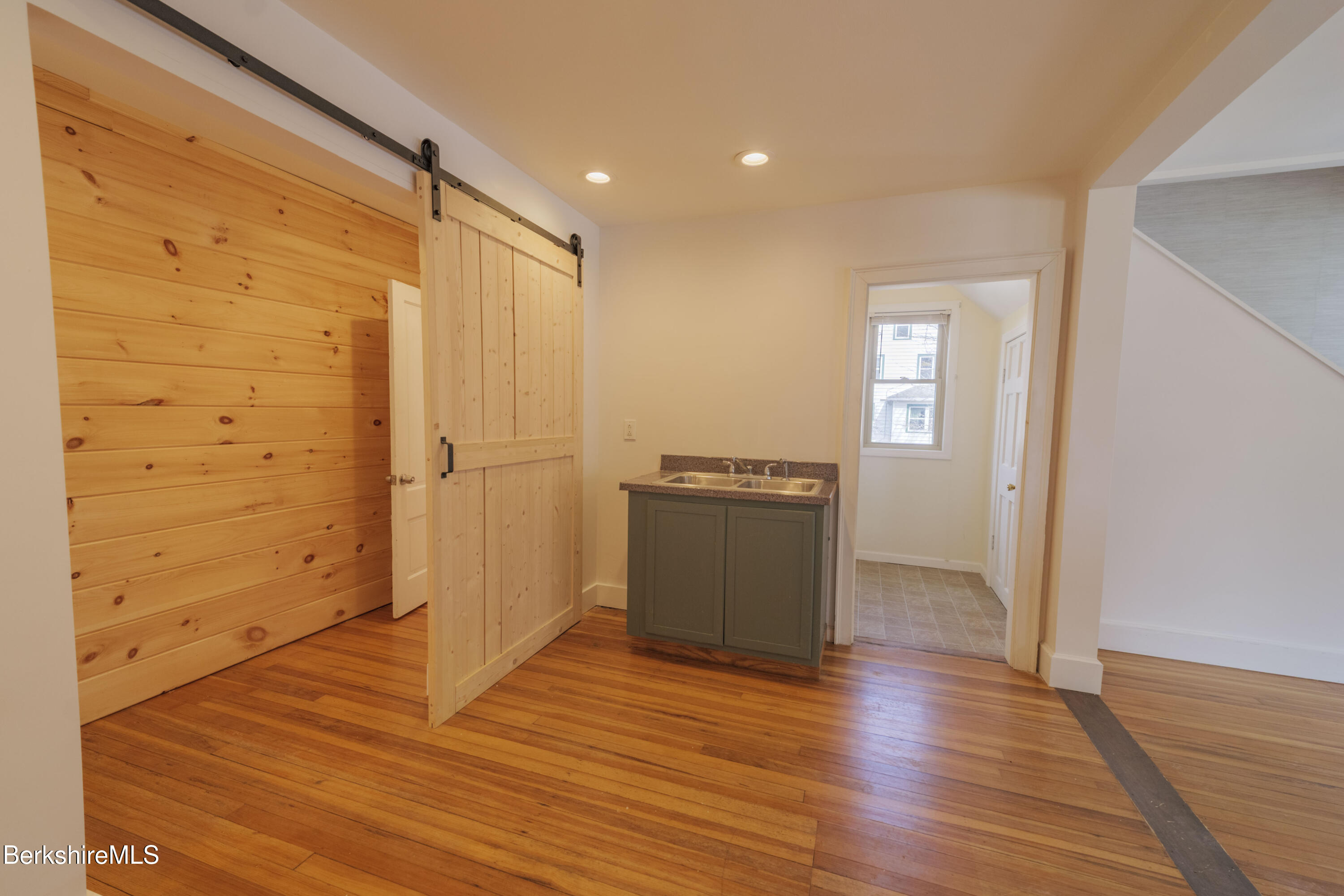 108 North Summer Street Adams, MA 01220 - Photo 4 of 28 a view of a room with wooden floor and cabinet