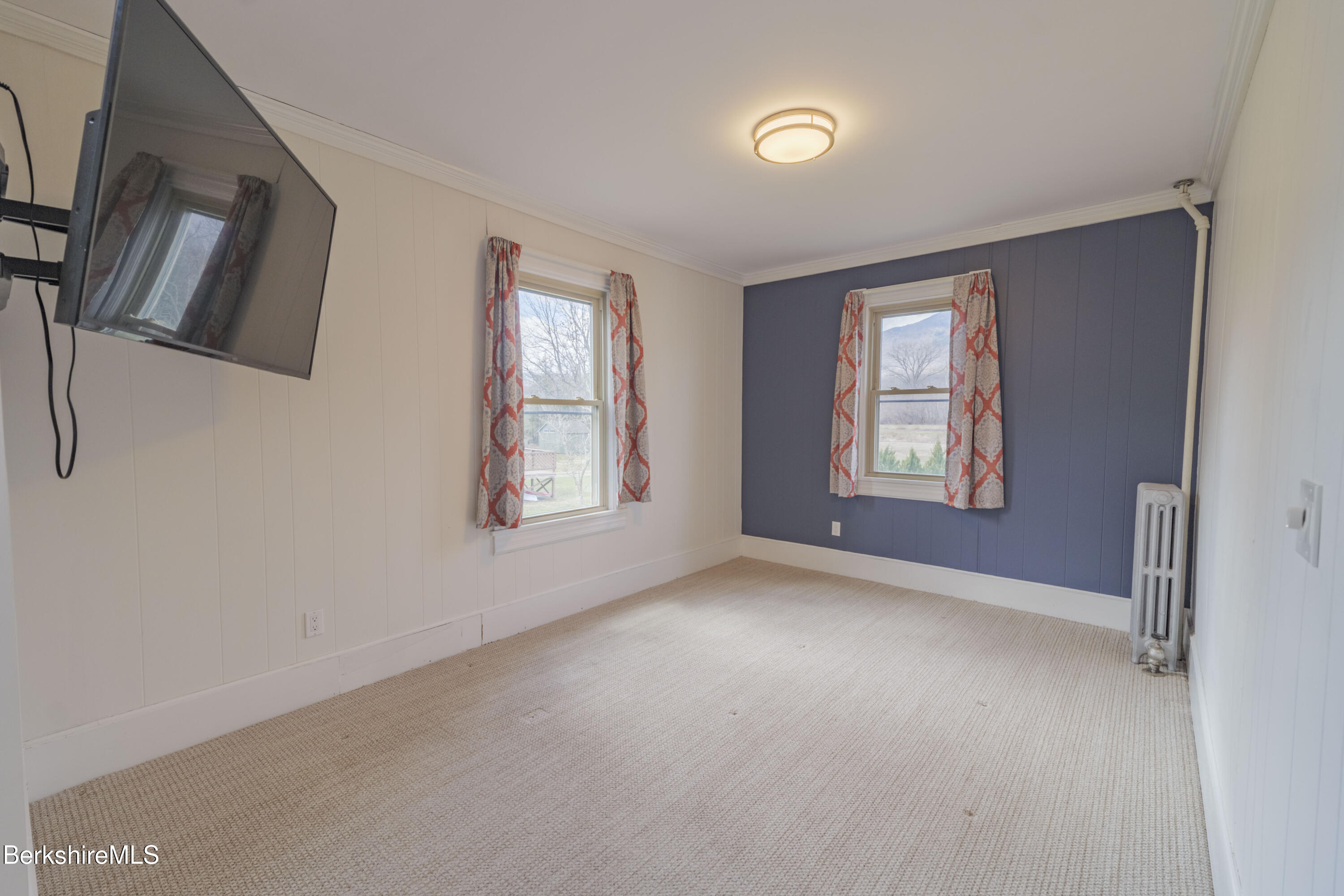 108 North Summer Street Adams, MA 01220 - Photo 6 of 28 a view of an empty room with a window