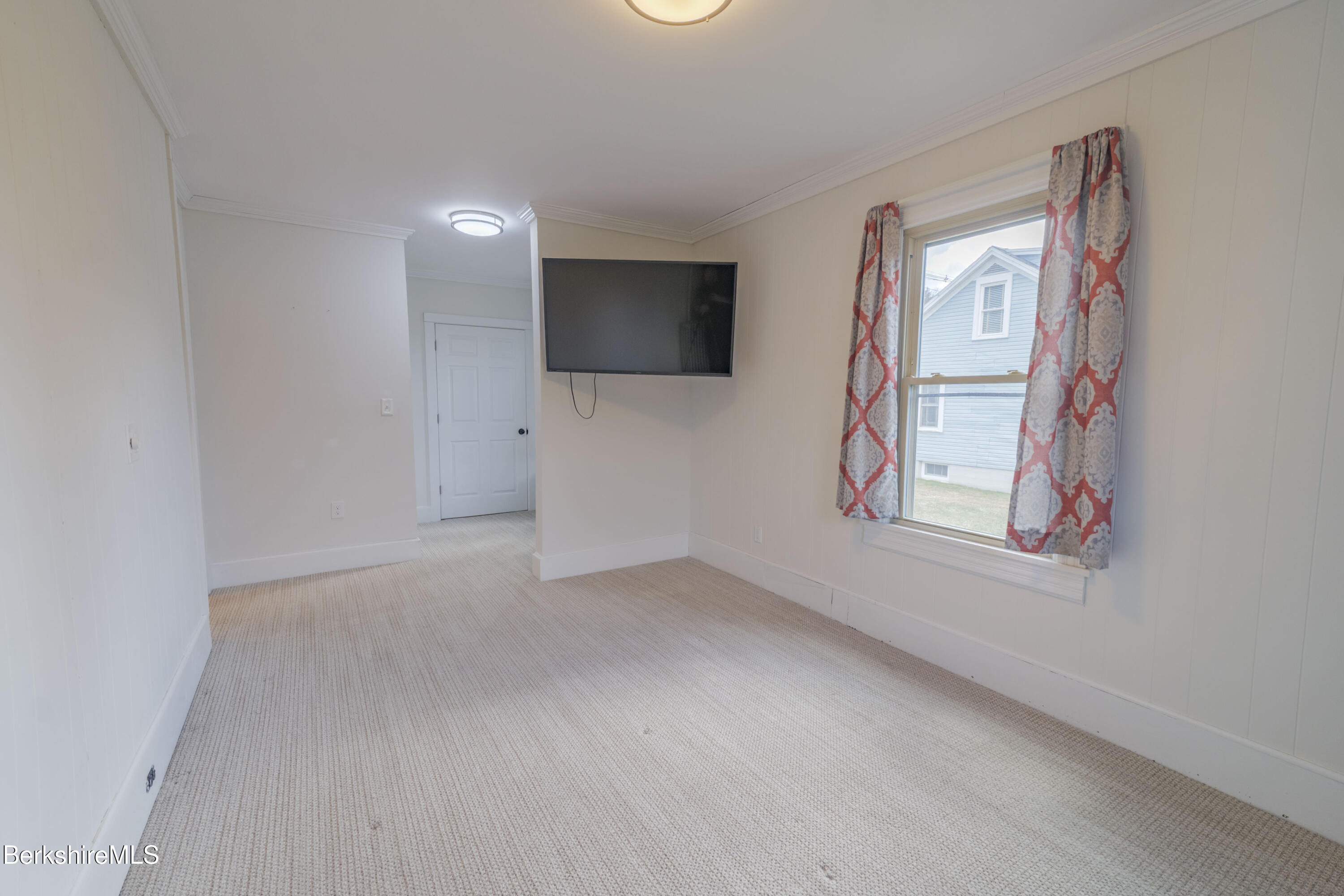 108 North Summer Street Adams, MA 01220 - Photo 7 of 28 an empty room with windows and television