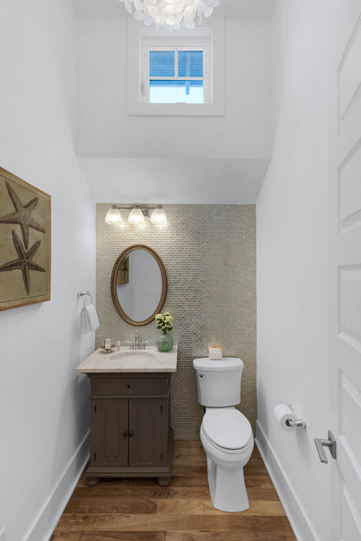 54 Chelsea Loop Road Santa Rosa Beach, FL 32459 - Photo 16 of 45 a bathroom with a toilet a sink and mirror