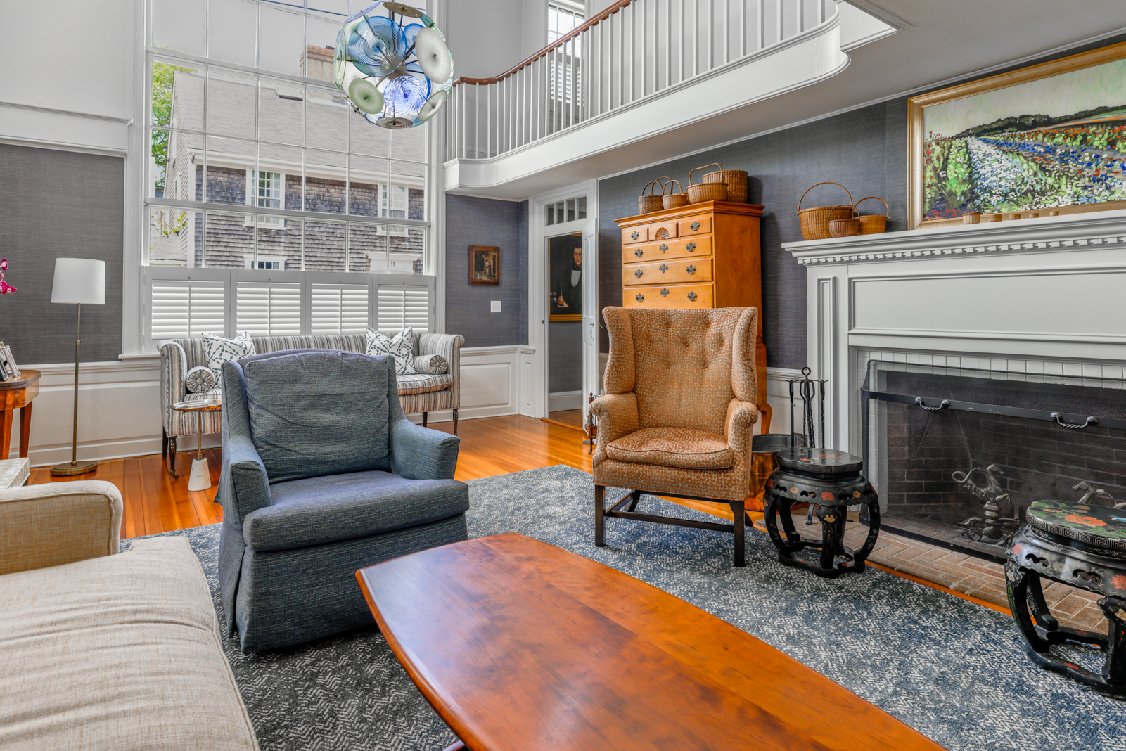 12 Hussey Street Nantucket, MA 02554 - Photo 15 of 47 a living room with furniture a fireplace and a large window