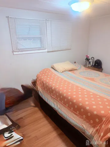 a bedroom with bed and window