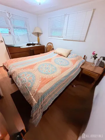 a bedroom with a bed and dresser