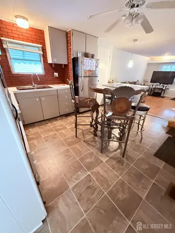 a living room with lots of furniture and a chandelier