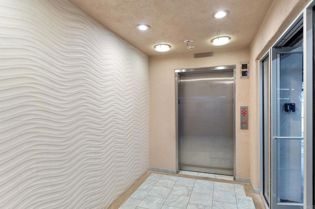 400 North Pacific Street, Unit 314 Oceanside, CA 92054 - Photo 17 of 20 a bathroom with a shower and a glass door