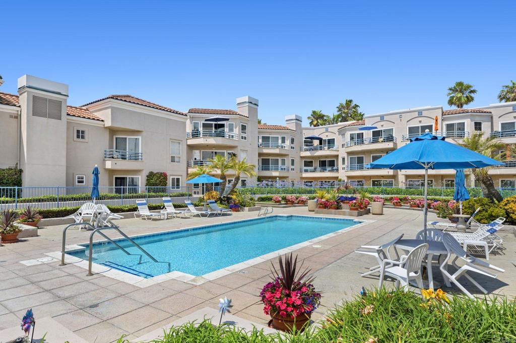 400 North Pacific Street, Unit 314 Oceanside, CA 92054 - Photo 19 of 20 a view of a swimming pool with outdoor seating