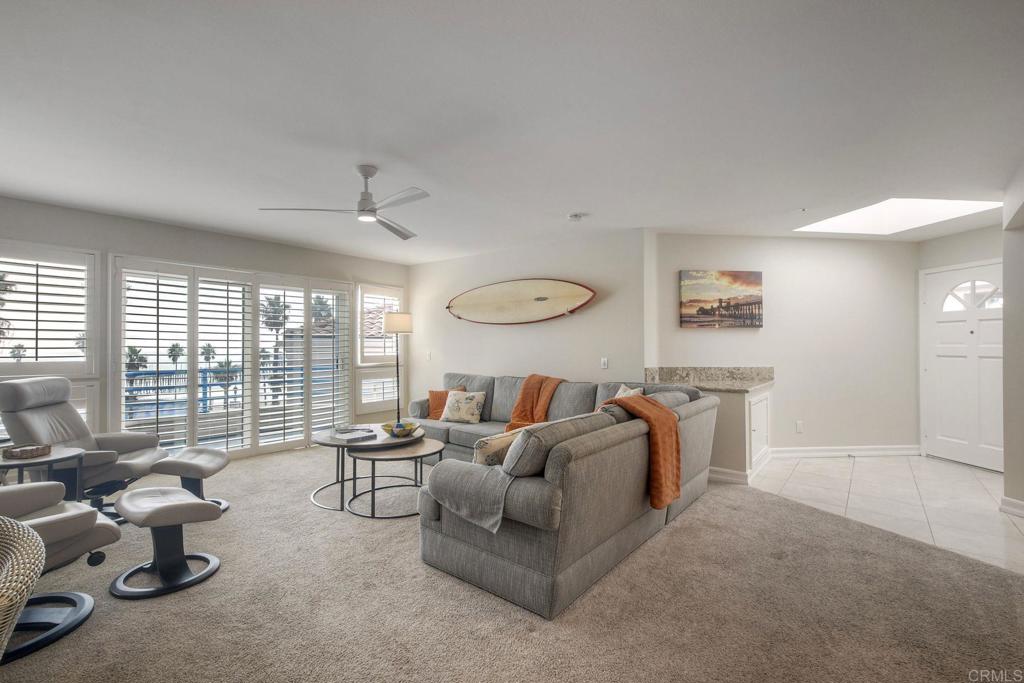 400 North Pacific Street, Unit 314 Oceanside, CA 92054 - Photo 3 of 20 a living room with furniture and a large window