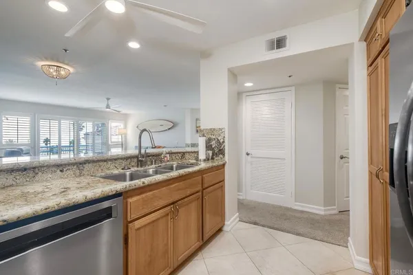 a kitchen with a sink and a refrigerator