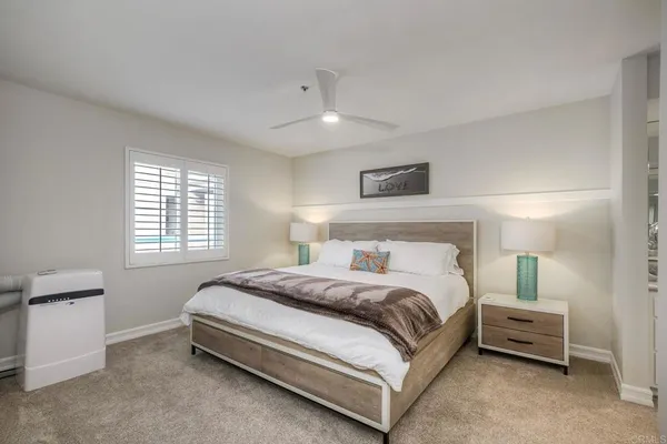 a bed room with a bed and a night stand