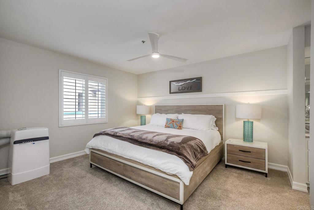 400 North Pacific Street, Unit 314 Oceanside, CA 92054 - Photo 8 of 20 a bed room with a bed and a night stand