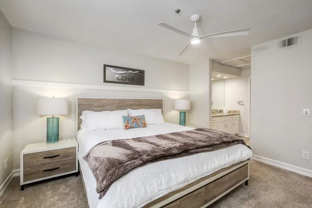 a bedroom with a bed and a view of bathroom